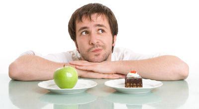 photo of a man with cake and an apple