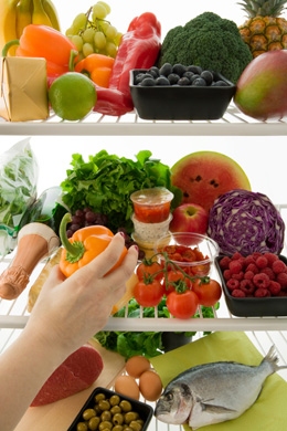 photo of a fridge full of fresh food